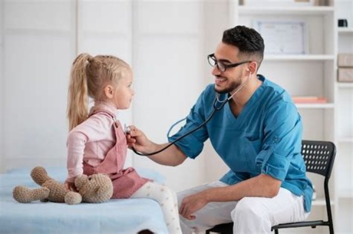 Do pediatricians work alone or with others?