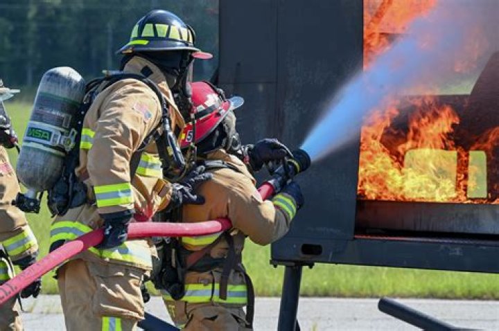 What do firefighters do to control the burning muck fires?