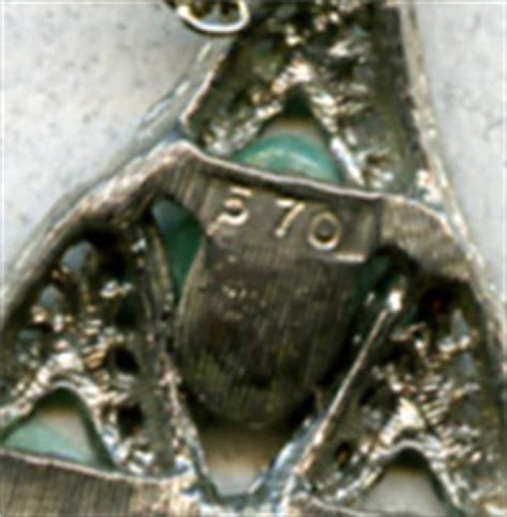 What does 570 mean on jewelry?