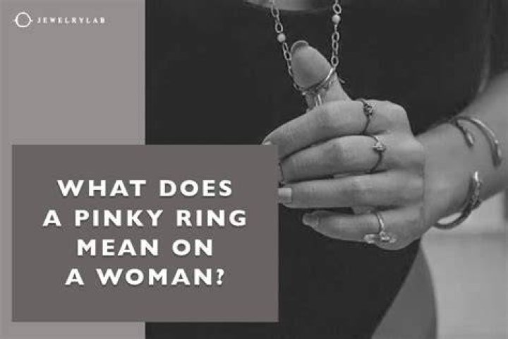 What does a right pinky ring mean on a woman?