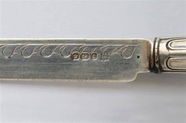 What does the IS stamp on silverware mean?