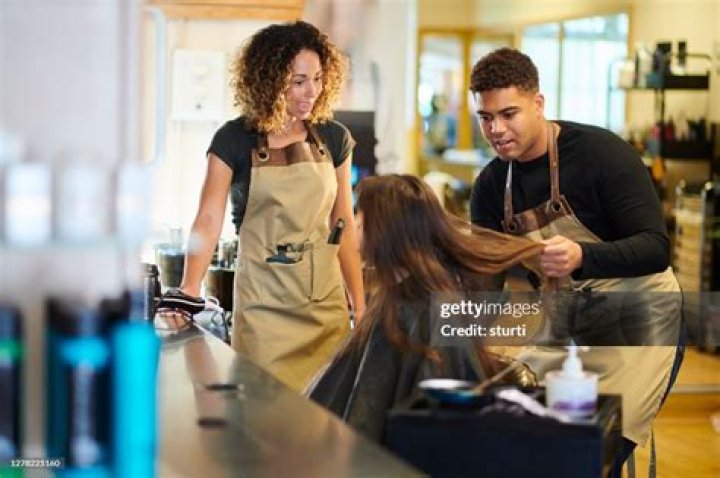 What is a junior stylist in hairdressing?