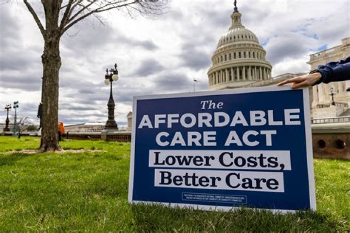 When did Obama sign the ACA into law?