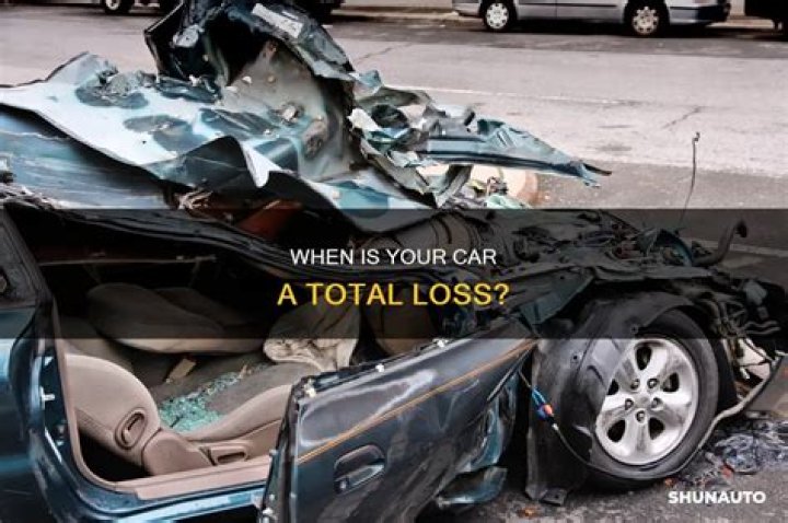 Who determines if a car is a total loss?