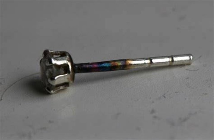 Why do my ears turn black with sterling silver earrings?